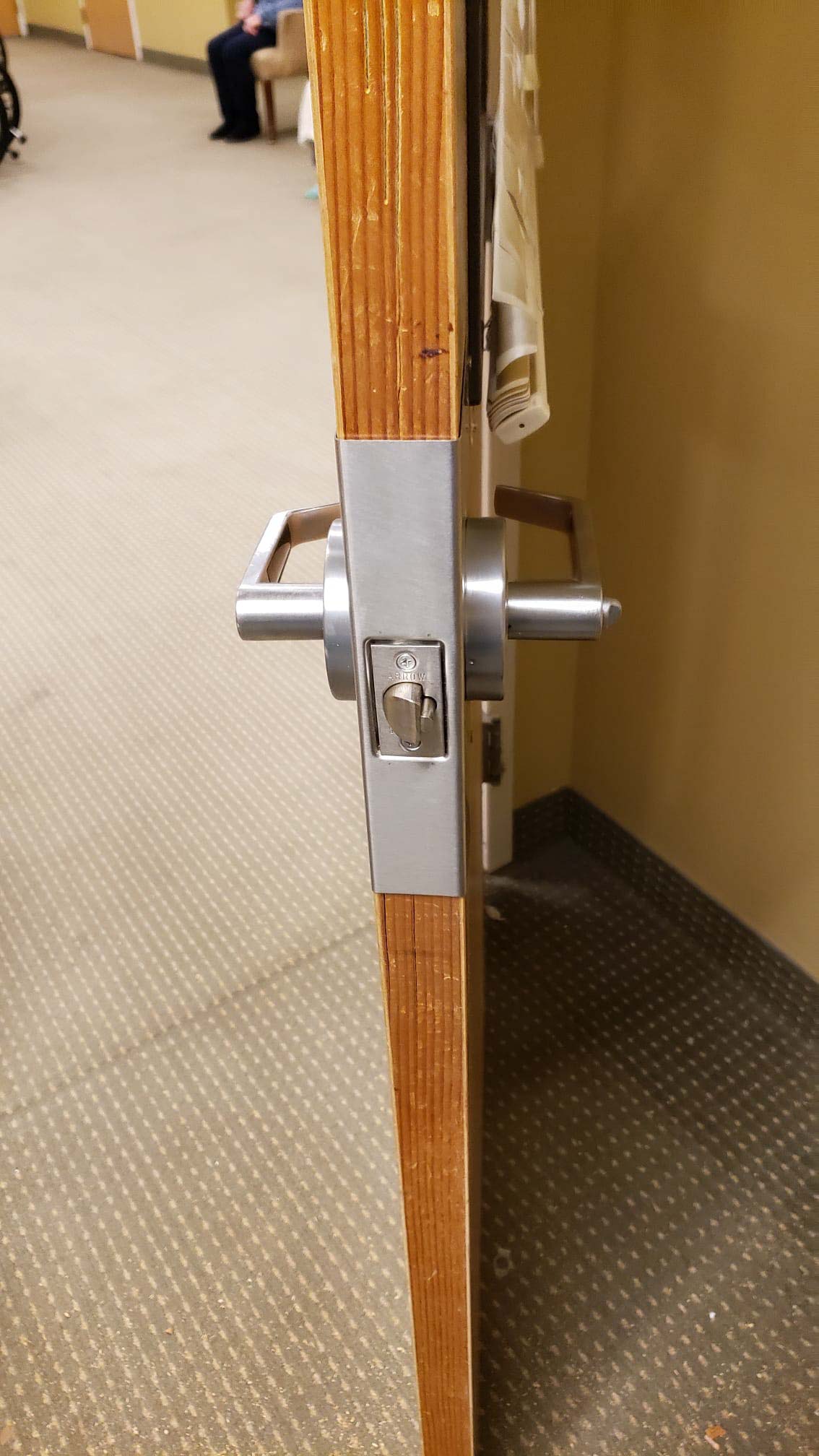 A commercial door latch repair